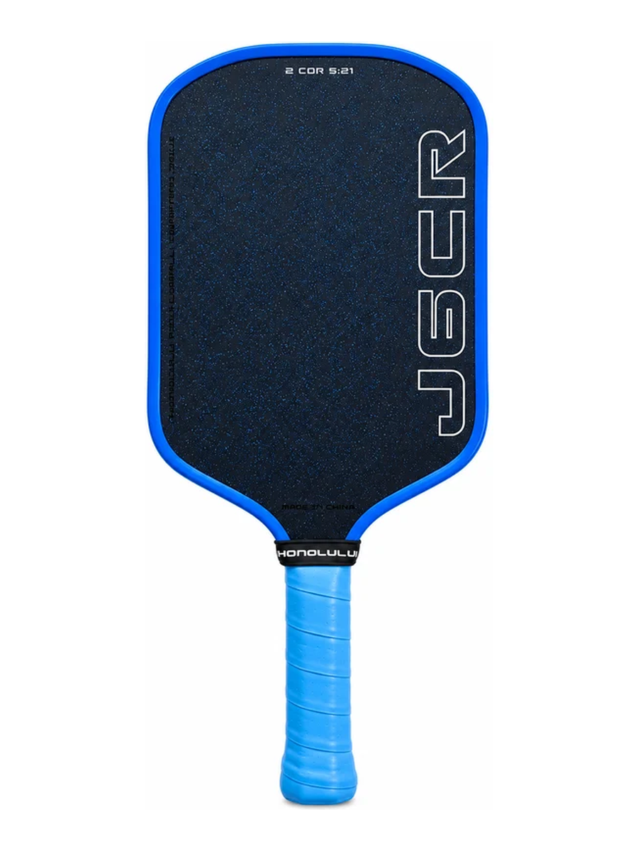 A J6CR pickleball paddle with a black textured paddle face, a bright blue border, and a blue wrapped handle, shown against a plain white background.